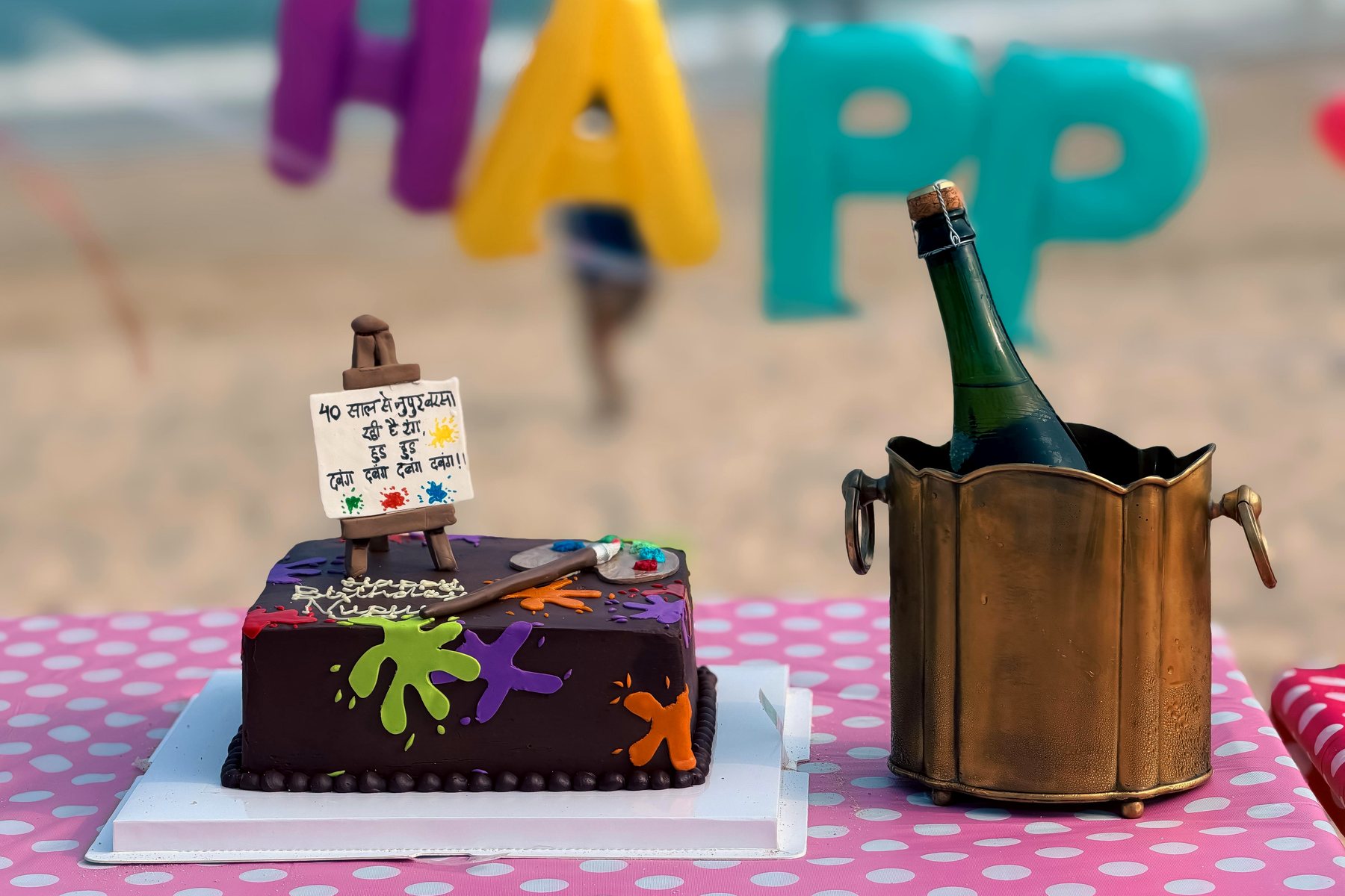 A close view of the decorated cake beside a champagne bucket