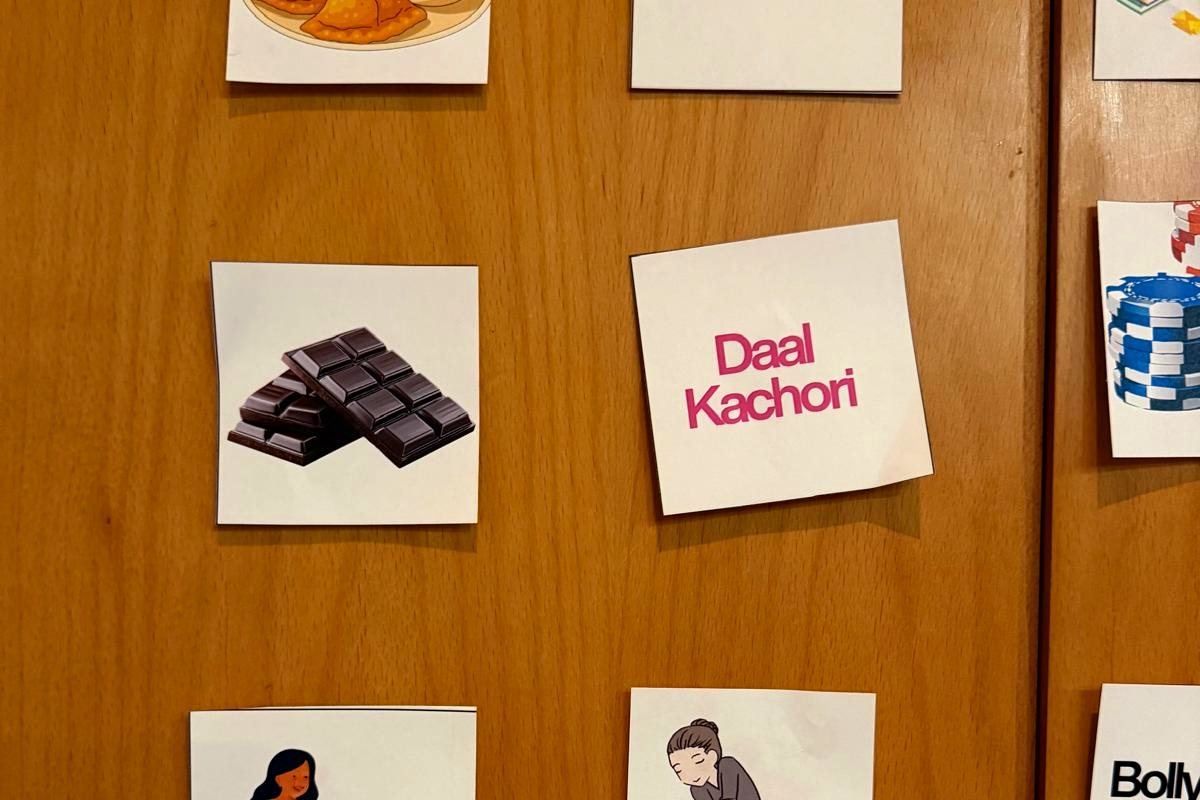 A printed game board of cards showing a person's likes and dislikes