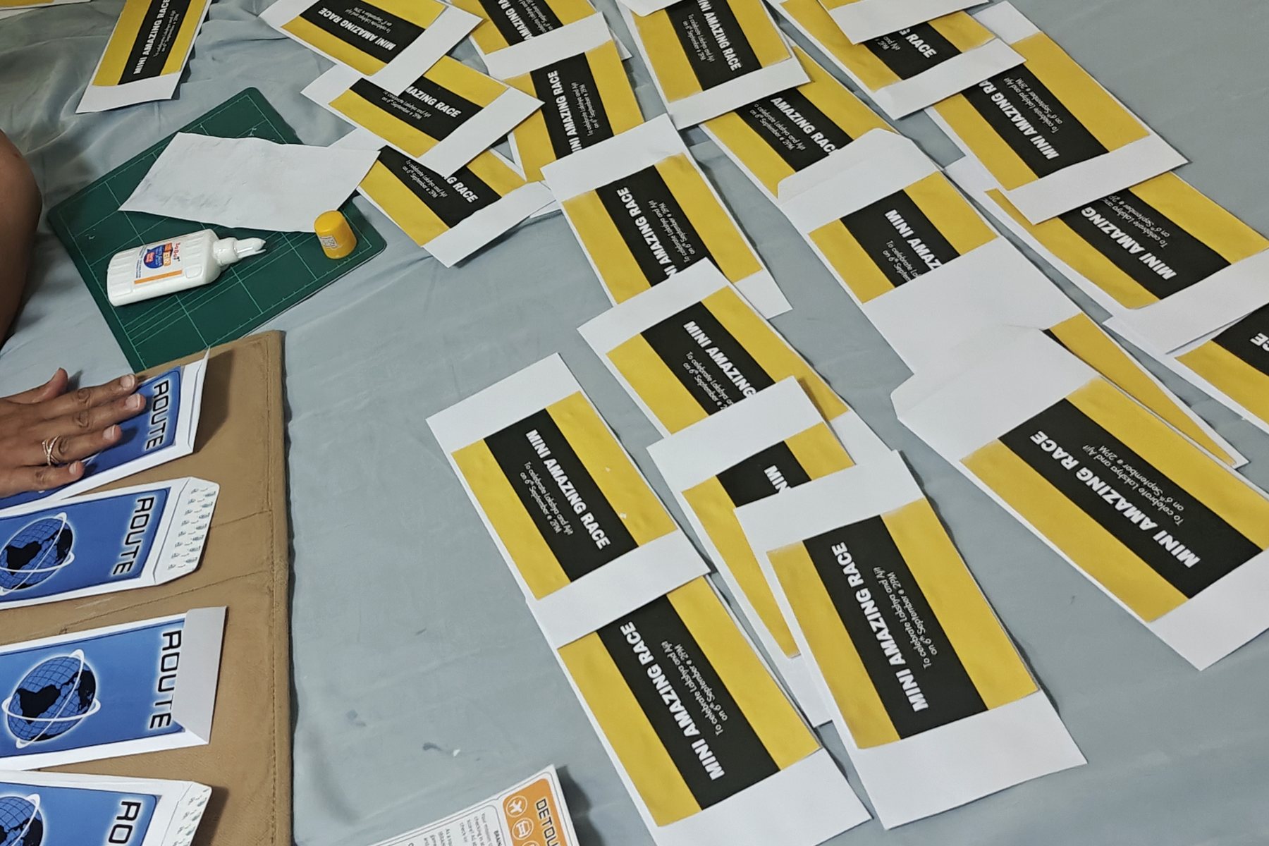 Printed race markers and route cards laid out for assembly