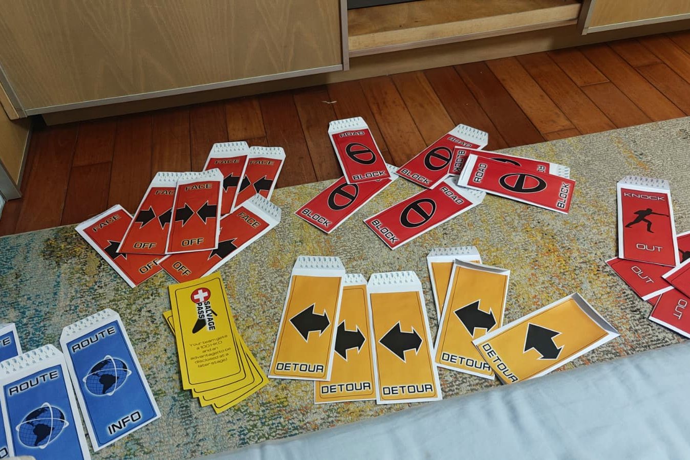 Printed task cards laid out in colour-coded rows