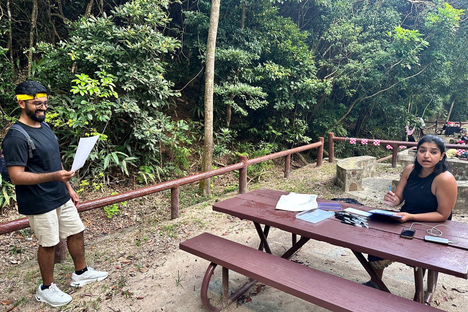 A checkpoint set up on a picnic table on the trail