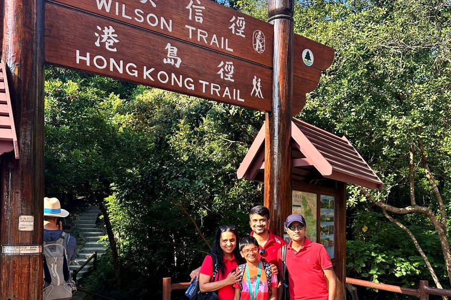 A team at a trail signpost during a race