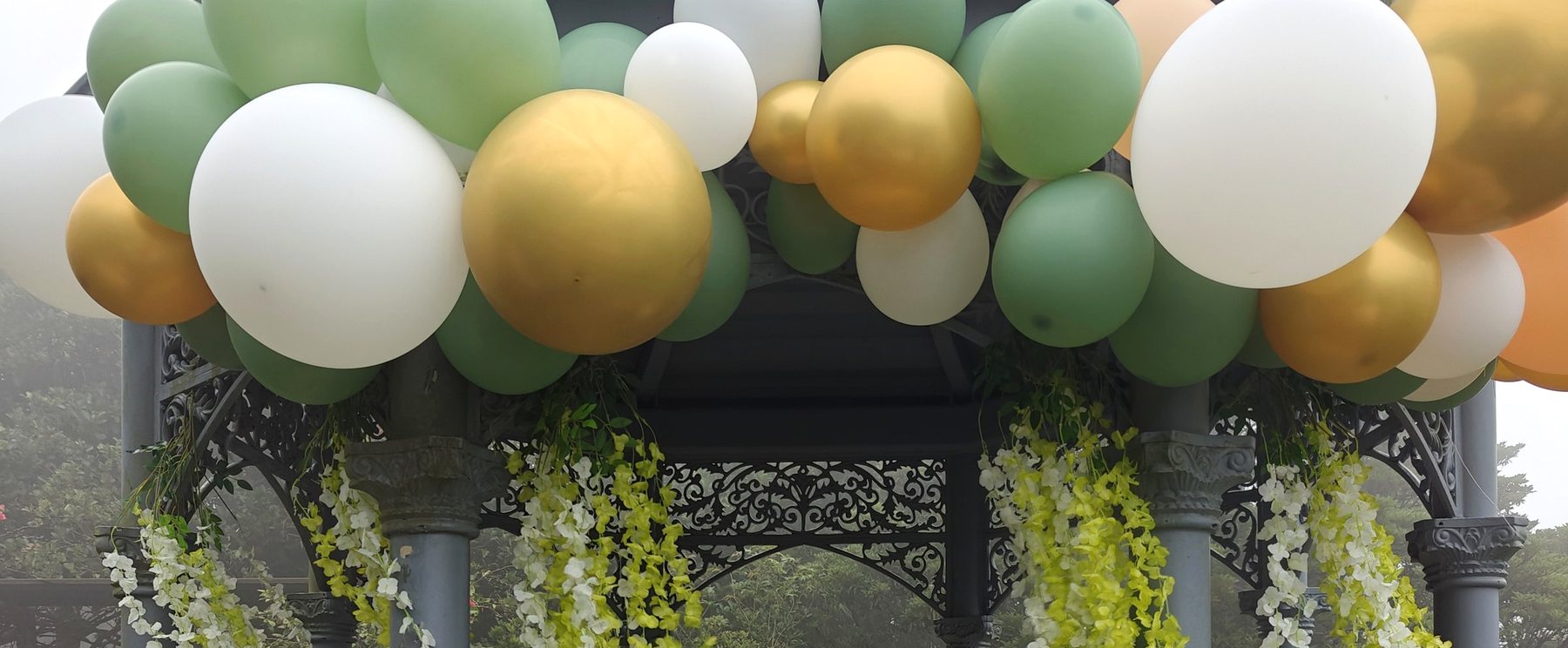 The dressed bandstand with hanging greenery