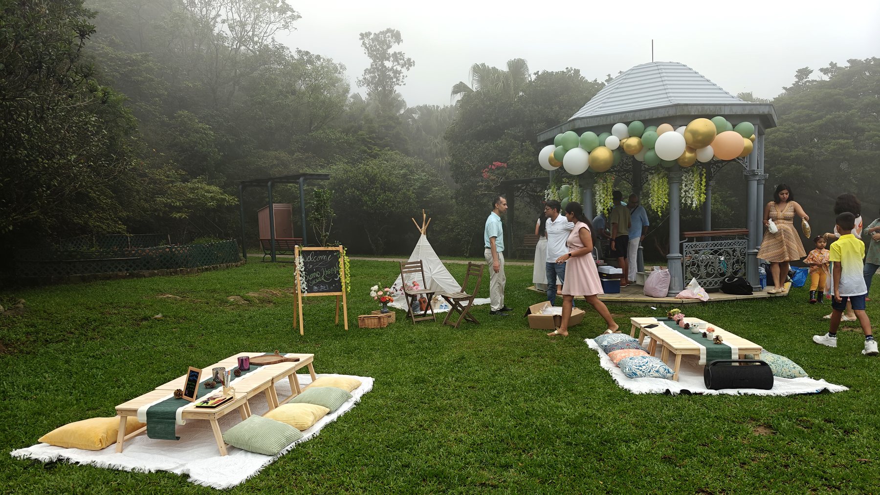A bandstand dressed with a balloon garland in the mist